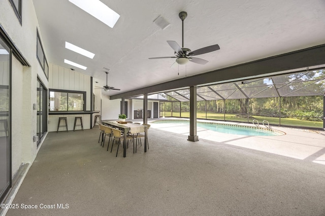 view of pool featuring ceiling fan and a skylight