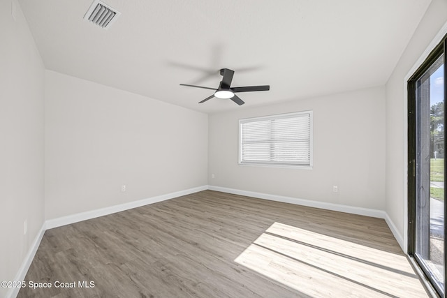 unfurnished room featuring ceiling fan and light hardwood / wood-style floors