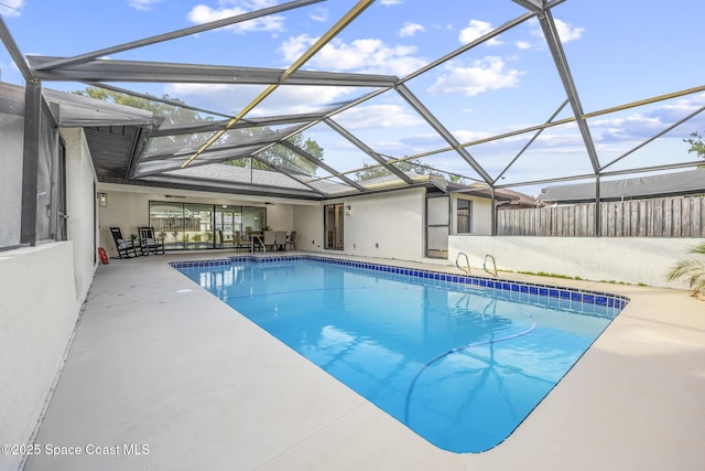 view of pool with a lanai and a patio area