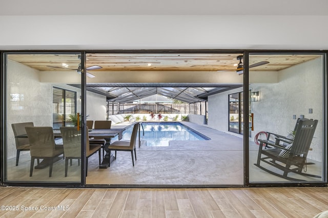 view of swimming pool with ceiling fan