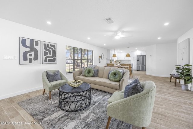 living room with ceiling fan