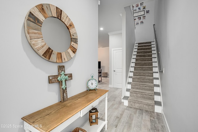 foyer featuring built in desk and light hardwood / wood-style floors