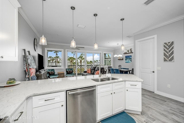 kitchen featuring dishwasher, white cabinetry, hanging light fixtures, and sink