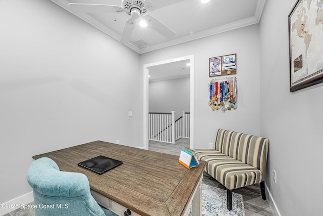 office space with ceiling fan and crown molding