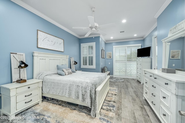 bedroom featuring ceiling fan, crown molding, and light wood-type flooring