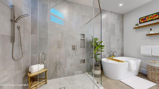 bathroom with shower with separate bathtub