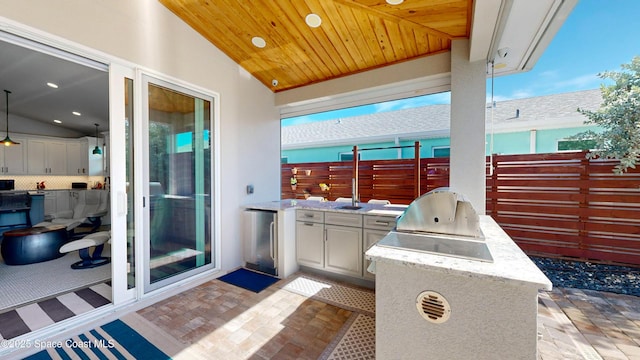 view of patio with exterior kitchen and grilling area