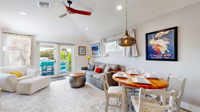 living room with ceiling fan and high vaulted ceiling