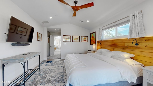 bedroom with ceiling fan, light hardwood / wood-style flooring, and lofted ceiling