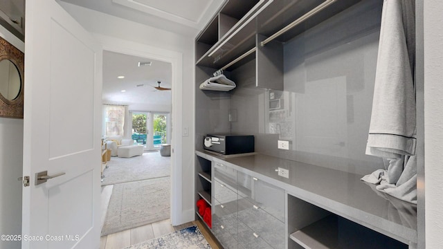 interior space featuring light hardwood / wood-style flooring and ceiling fan