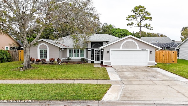 ranch-style home with a garage and a front lawn