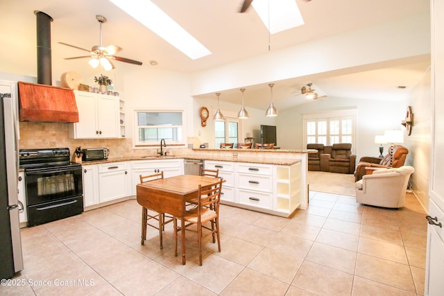 kitchen featuring pendant lighting, electric range, decorative backsplash, stainless steel dishwasher, and white cabinetry