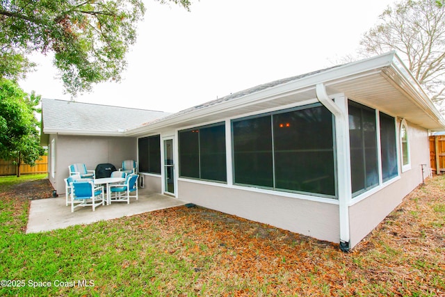 back of property featuring a patio area