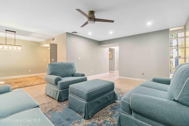 living room with light tile patterned floors and ceiling fan