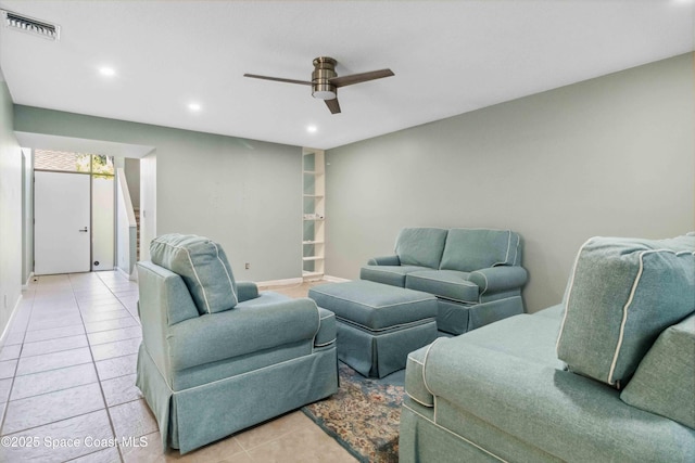 tiled living room with ceiling fan