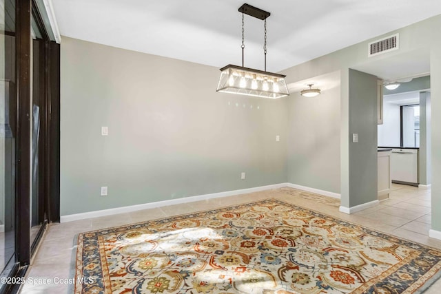 spare room featuring light tile patterned floors