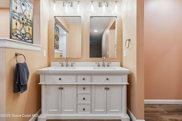 bathroom featuring vanity and wood-type flooring