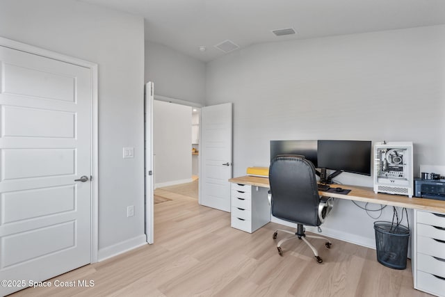 office area with light hardwood / wood-style flooring