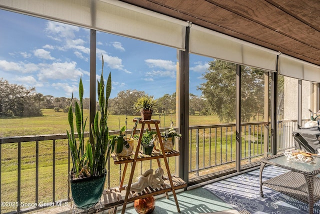 unfurnished sunroom with a rural view