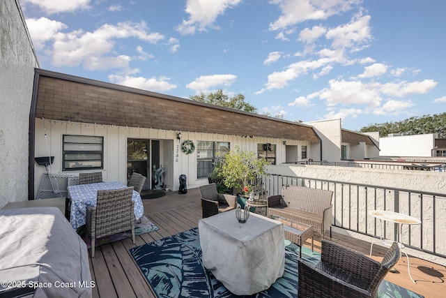 wooden deck with outdoor lounge area