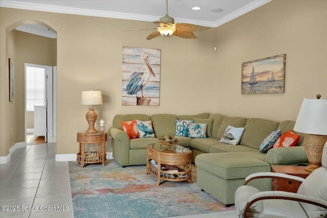 living room featuring tile patterned flooring, ceiling fan, and ornamental molding