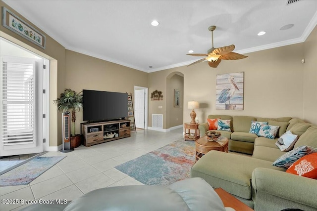 living room featuring crown molding, light tile patterned floors, and ceiling fan