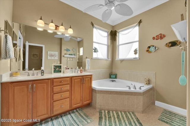 bathroom featuring vanity, a relaxing tiled tub, tile patterned floors, and ceiling fan