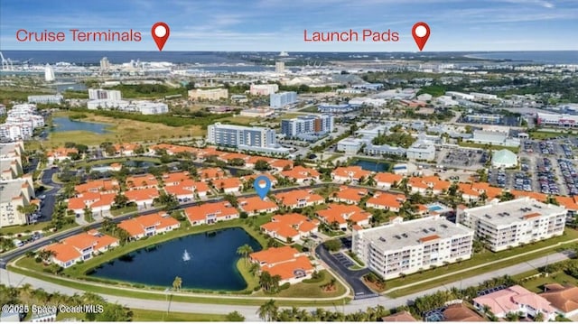 8660 Villanova Dr Unit 801, Cape Canaveral, FL 32920 - drone / aerial view with a city view and a water view
