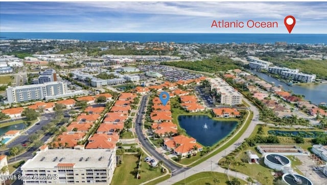 8660 Villanova Dr Unit 801, Cape Canaveral, FL 32920 - drone / aerial view with a water view and a view of city
