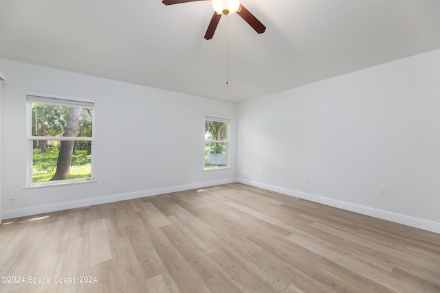 unfurnished room featuring ceiling fan and light hardwood / wood-style flooring