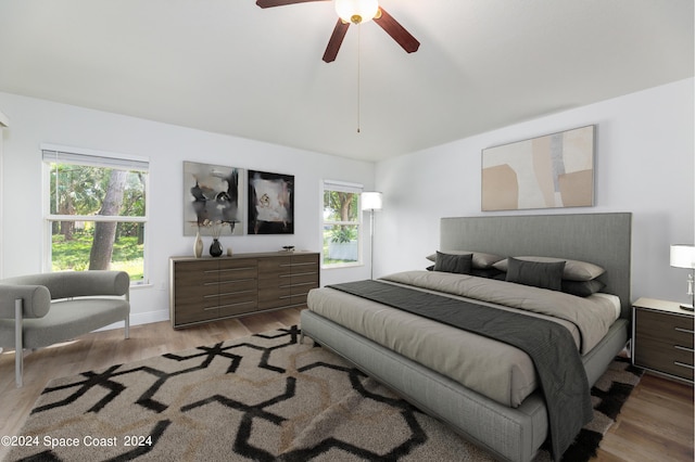 bedroom featuring ceiling fan and light hardwood / wood-style floors