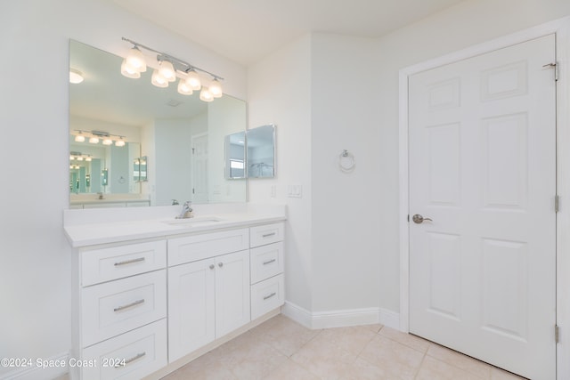 bathroom featuring tile patterned flooring and vanity