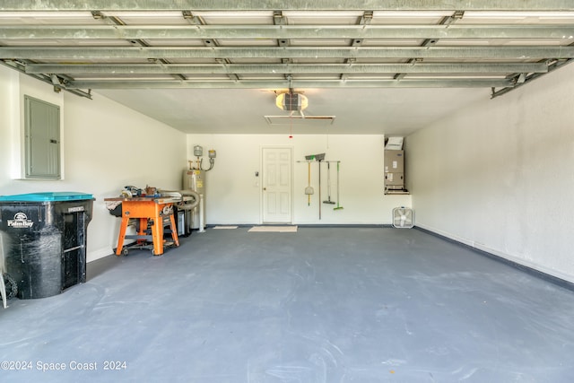 garage with electric panel, water heater, heating unit, and a garage door opener