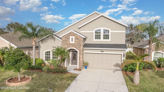 view of front of home with a front lawn and a garage