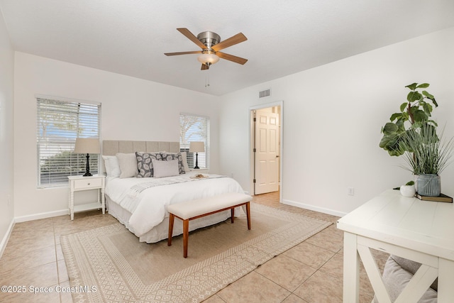 tiled bedroom with ceiling fan