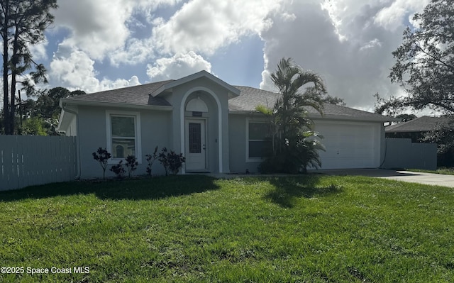 single story home with a garage and a front yard