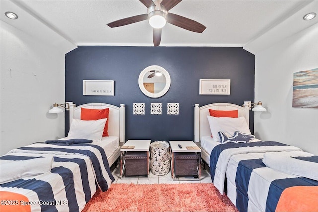 bedroom featuring light tile patterned floors, vaulted ceiling, and ceiling fan