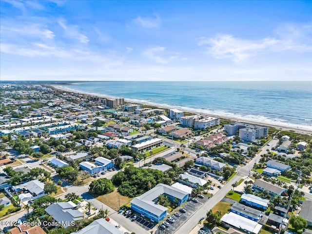 bird's eye view featuring a beach view and a water view