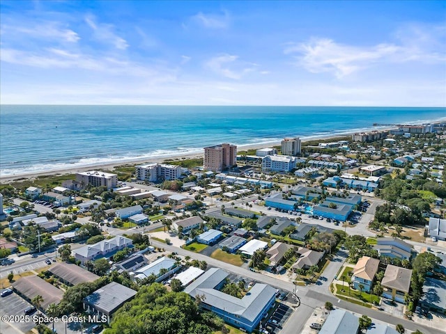 drone / aerial view with a water view and a view of the beach