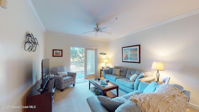 living room with ceiling fan, light colored carpet, and ornamental molding