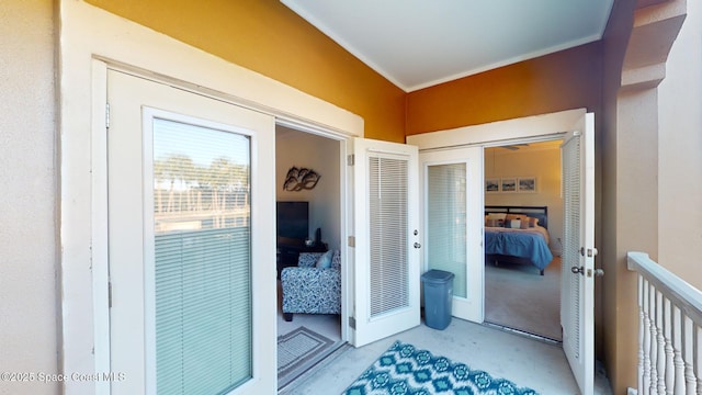 interior space featuring concrete floors and ornamental molding