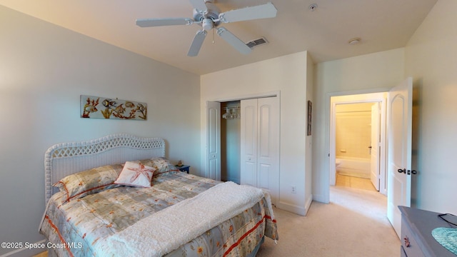 bedroom with ceiling fan, a closet, and light colored carpet