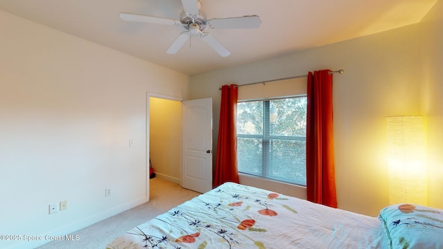 bedroom with light colored carpet and ceiling fan