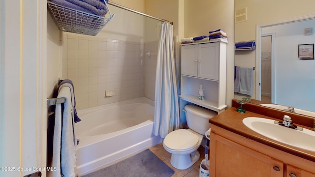 full bathroom featuring tile patterned flooring, vanity, shower / bath combo, and toilet