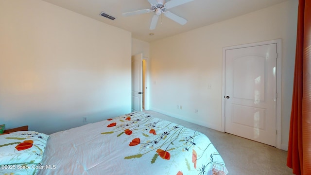 bedroom featuring ceiling fan and light colored carpet