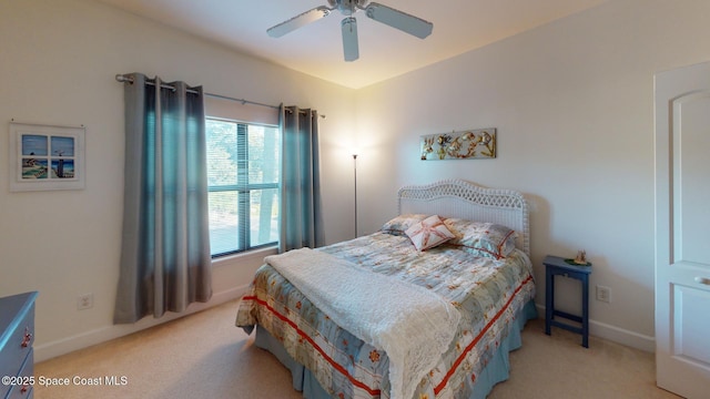 bedroom featuring ceiling fan and light colored carpet