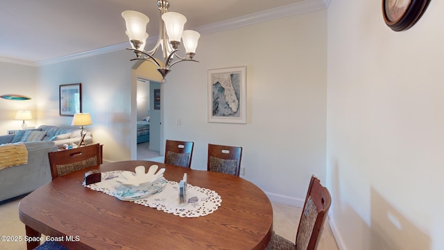 dining room with light carpet, an inviting chandelier, and ornamental molding