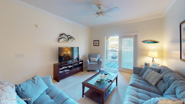 living room featuring crown molding, ceiling fan, and light colored carpet