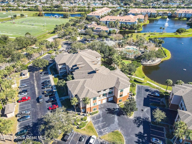 birds eye view of property featuring a water view