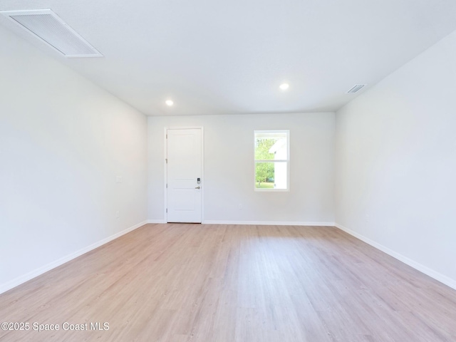 unfurnished room featuring light hardwood / wood-style floors